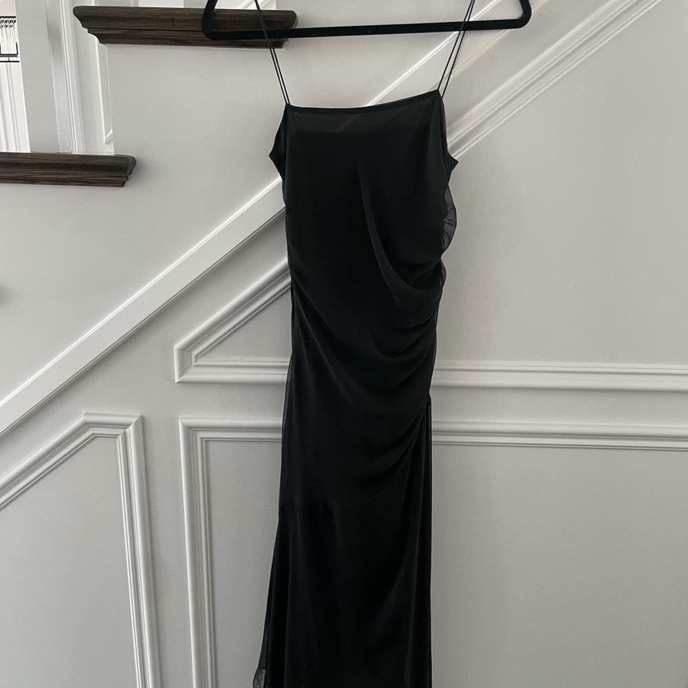 Elegant LBD with side gathering and asymmetrical hem line.